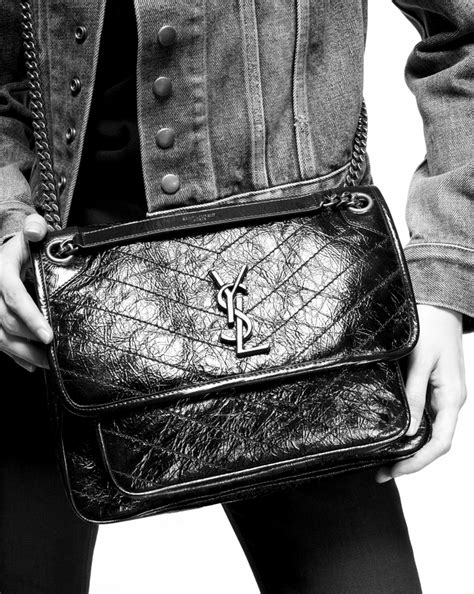 ysl niki baby vintage leather|yves saint laurent niki bag.